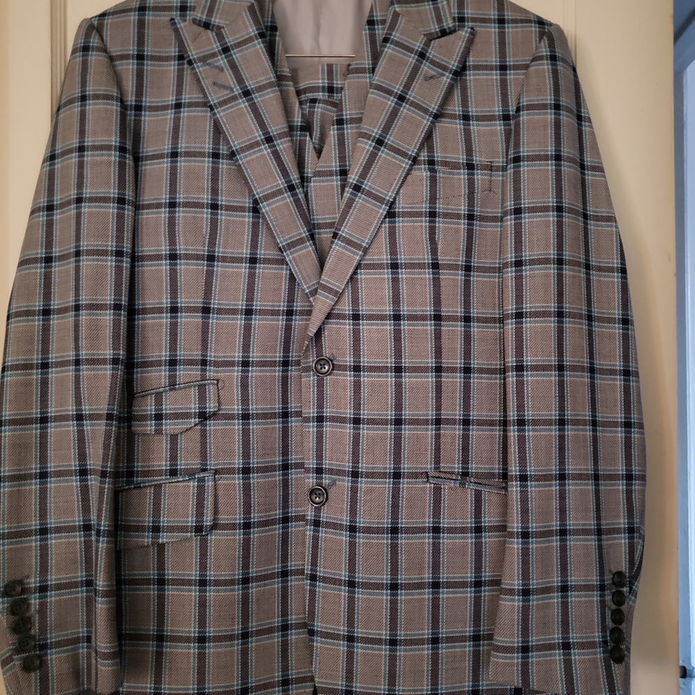 Sophisticated Tiglio Rosso 3 piece men's suit. Shades of blue plaid.